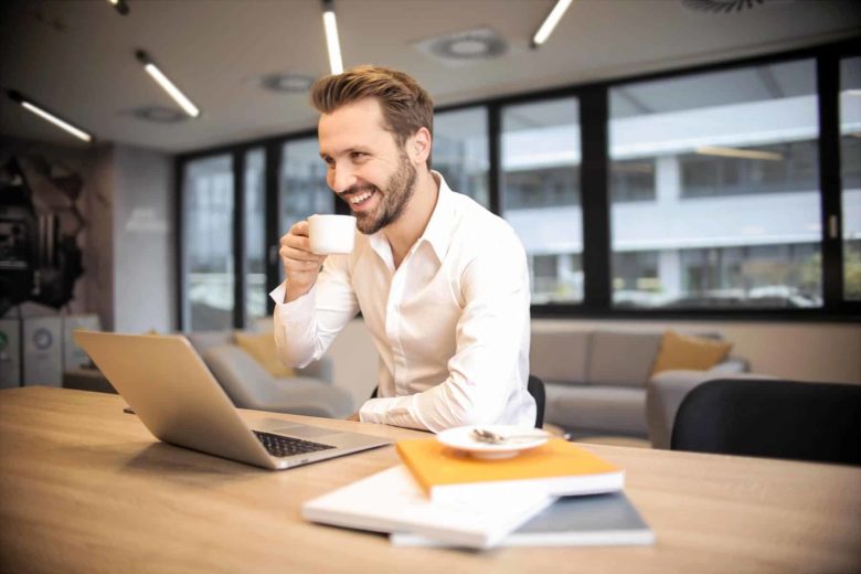 Businessman with Macbook pro & coffee